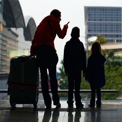 Family vs Business Travel - 5 Tips To Ditching Your Business Mindset And Enjoy Your Travel Time Off - The Wise Traveller - Family at Airport