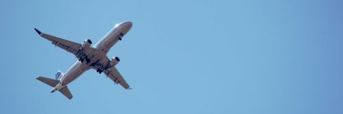 How To Beat Your Fear of Flying - The Wise Traveller - Airplane and blue sky