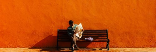 Latest Travel News Round Up - The Wise Traveller - Old man reading newspaper