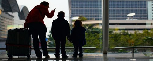 Surviving Taking the Kids on a Business Trip - The Wise Traveller - Family at airport