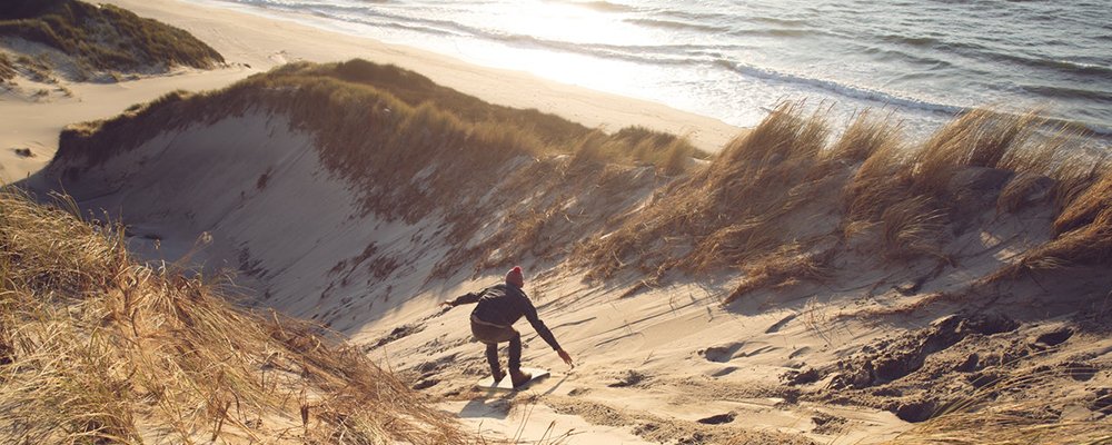 6 Activities to Get You Outdoors While Traveling - The Wise Traveller - Sandboarding