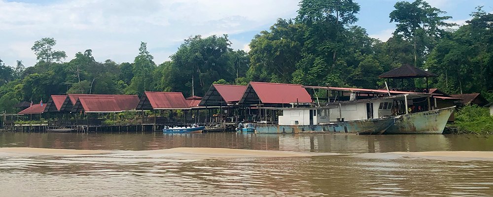 A Gift to the Earth - The Kinabatangan River - Sabah, Borneo - The Wise Traveller - River Bank with Boats