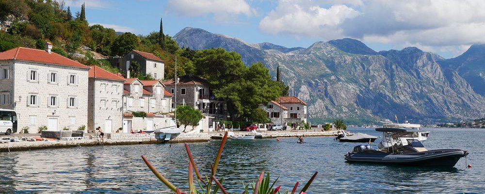  A Salty Breeze, Olive Oil and an Old Lady on a Rock - The UNESCO Town of Kotor, Montenegro - The Wise Traveller - Picturesque Perast with boats in the Bay of Kotor