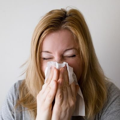 How to Avoid the Coronavirus When Travelling - The Wise Traveller - Sick woman