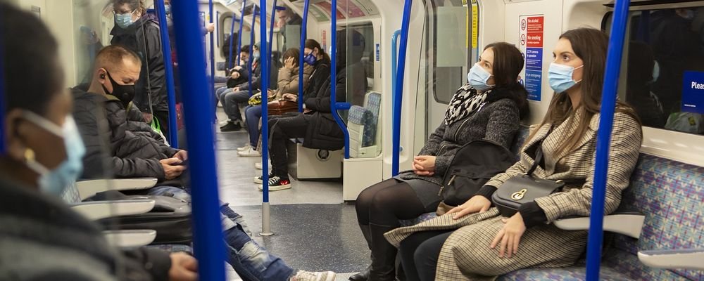 How to be a more responsible traveller during the pandemic - The Wise Traveller - Passengers with mask