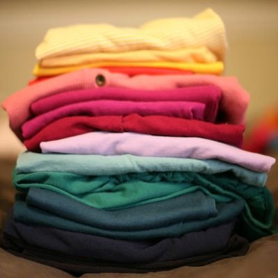 Making the Most of Suitcase Space—Top Travel Packing Tips - The Wise Traveller - Folding clothes
