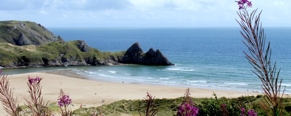 Where to Find the U.K.’s Best Beaches - The Wise Traveller - Three Cliffs Bay